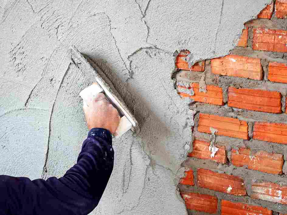 Worker Plastering On Brick Wall | UltraTech Cement