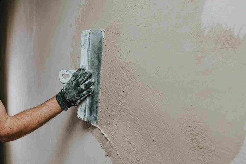 Worker Applying Plaster On Cement Wall | UltraTech Cement