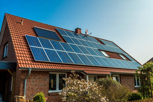 Solar panel on a red roof 