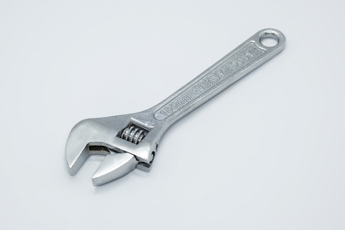 An adjustable wrench on a plain background | Ultratech