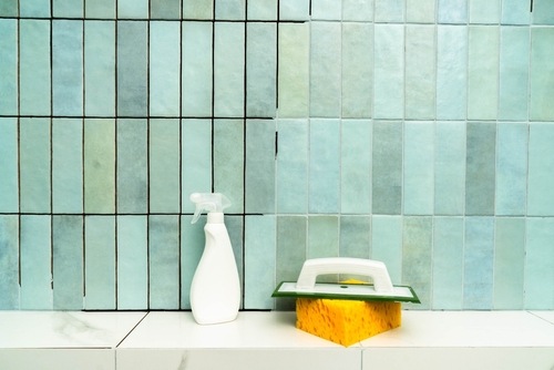 Tiling tools on shelf against a blue tile wall | Ultratech