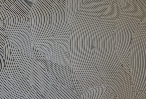Grey tile adhesive comb marks texture | Ultratech