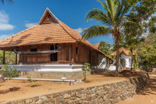 rural like wonderful view of residential house constructed using ceramic tiles on top of roof which helps during summer season and provides a good shelter for better living