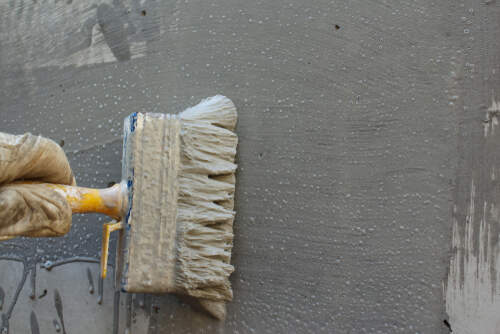 Worker Applying Waterproofing Liquid | UltraTech Cement