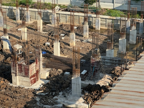The group of pile foundation of building in site. Many building pillar while under construction in land. Ground column in site.