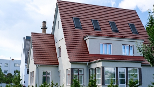 Large house with brown tiled roof and skylights | Ultratech
