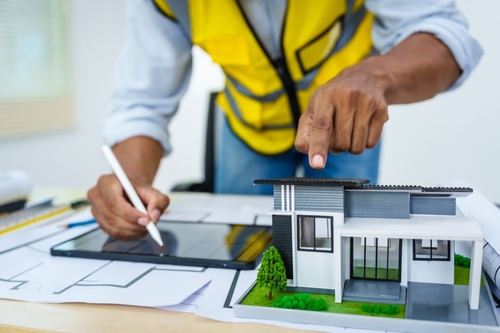 Architect pointing at a miniature house model | Ultratech