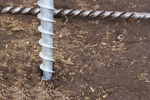 Galvanized screw pile foundation system used for ground anchoring and residential construction projects