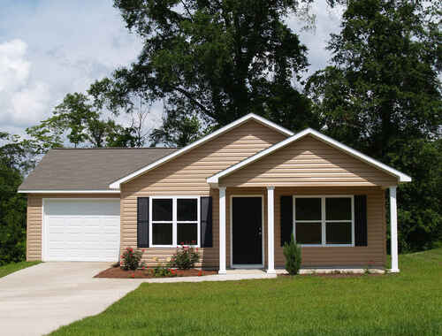 One story residential low income home with vinyl siding on the facade.