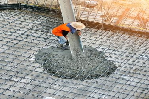 Worker applying M10 concrete mix  | UltraTech