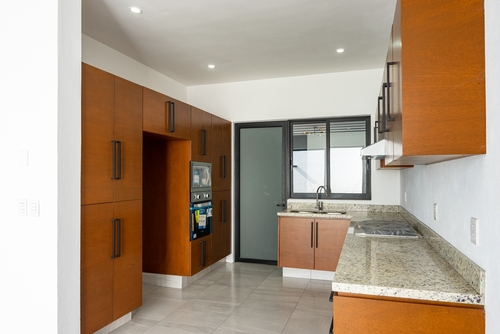 Wooden kitchen cabinets with a marble counter | Ultratech