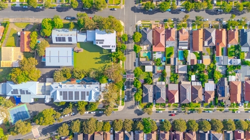 An aerial view of a residential neighborhood with houses and roads | Ultratech