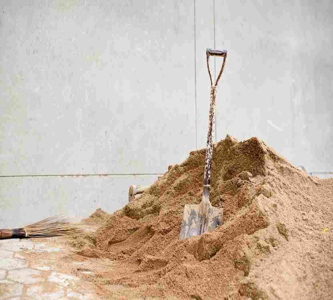 Shovel Kept in Sand | UltraTech Cement