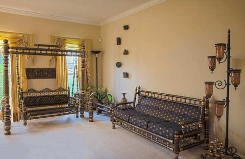 Interior view of a room with traditional Sankheda furniture from Western India