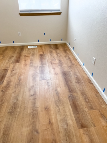 Applying tape to a floor joint using a tool | Ultratech