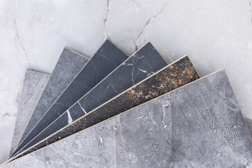 Tiling tools on shelf against a blue tile wall | Ultratech