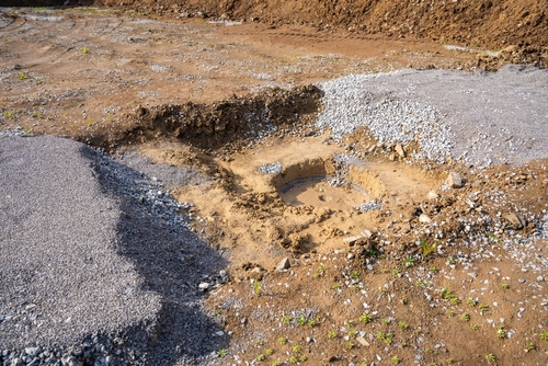 Excavated ground with gravel and soil at a construction site