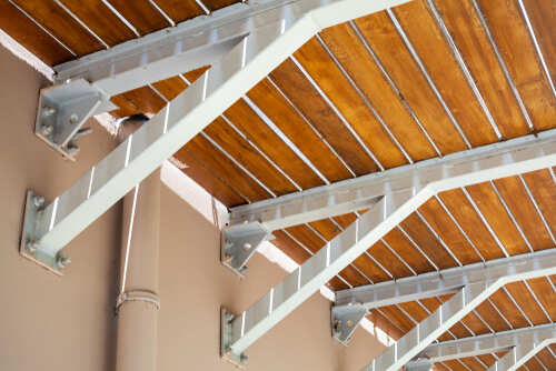 Wooden balcony floor mounted on cantilever beams, bottom view