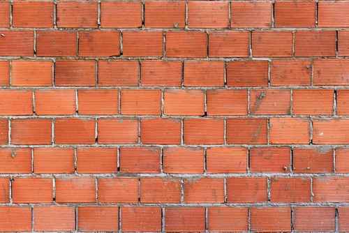 Laal eent ki deewar ka nirmaan, ghar banane ke liye paramparik brick masonry pattern