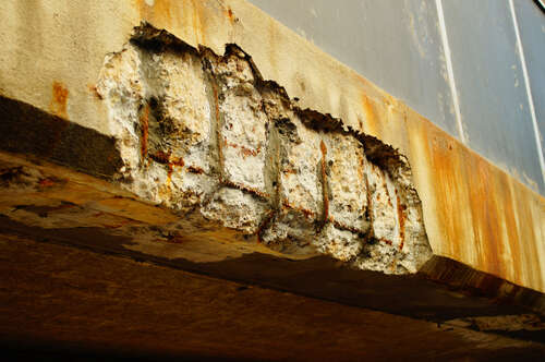 Corrosion damage on a concrete bridge on a busy thoroughfare in Frankfurt  With an age of about 50 years, it has its best days behind it 