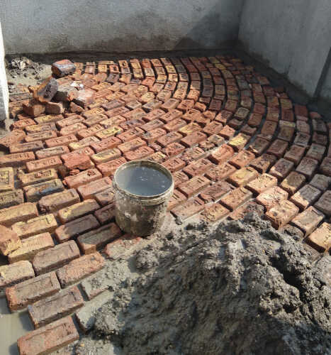 view of preparation of terrace waterproofing .bricks paving on terrace floor before waterproofing.