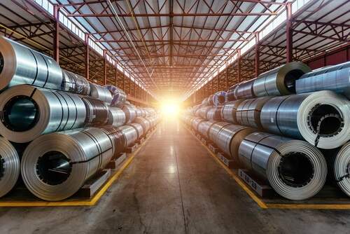 Rolls of galvanized steel sheet inside the factory or warehouse.