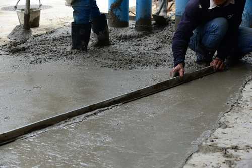Worker Adjusting Concrete | UltraTech Cement