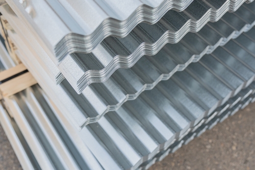 A stack of corrugated metal roofing sheets | Ultratech